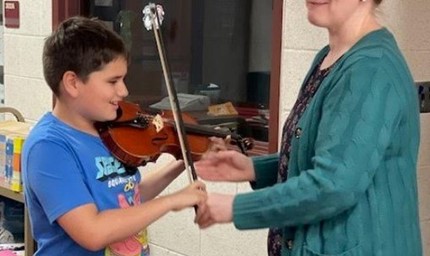 Student Learning to Play Violin